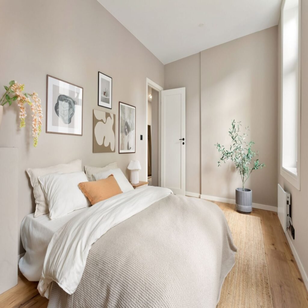 Modern bedroom decor with warm white walls and simple budget-friendly decor
