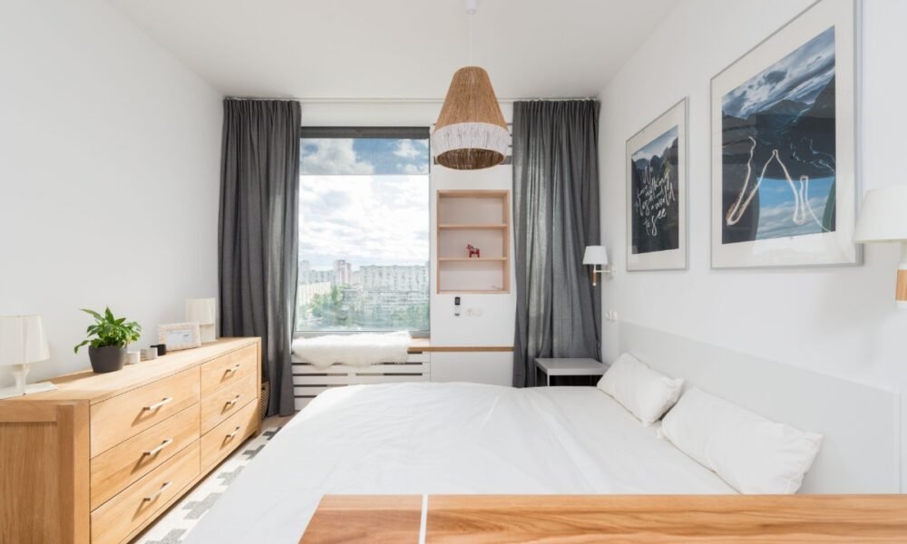 Small apartment bedroom with space-saving furniture, smart storage, and modern decor