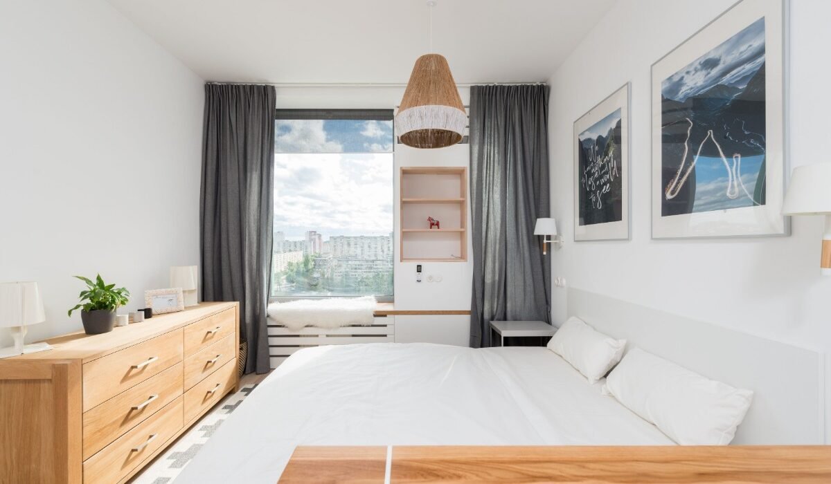 Small apartment bedroom with space-saving furniture, smart storage, and modern decor