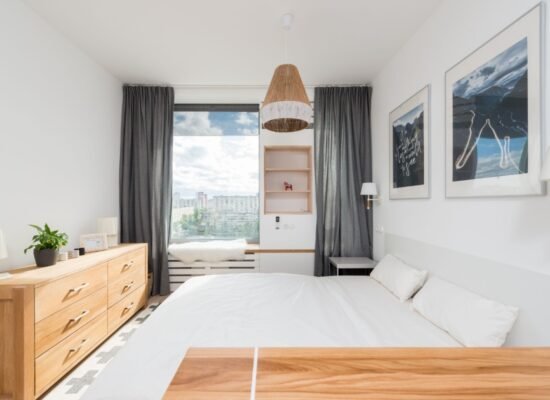 Small apartment bedroom with space-saving furniture, smart storage, and modern decor