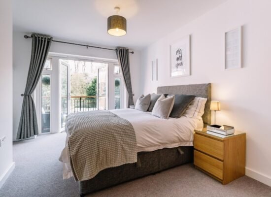 Modern bedroom decor ideas on a budget featuring a bright and cozy bedroom with neutral bedding and natural light