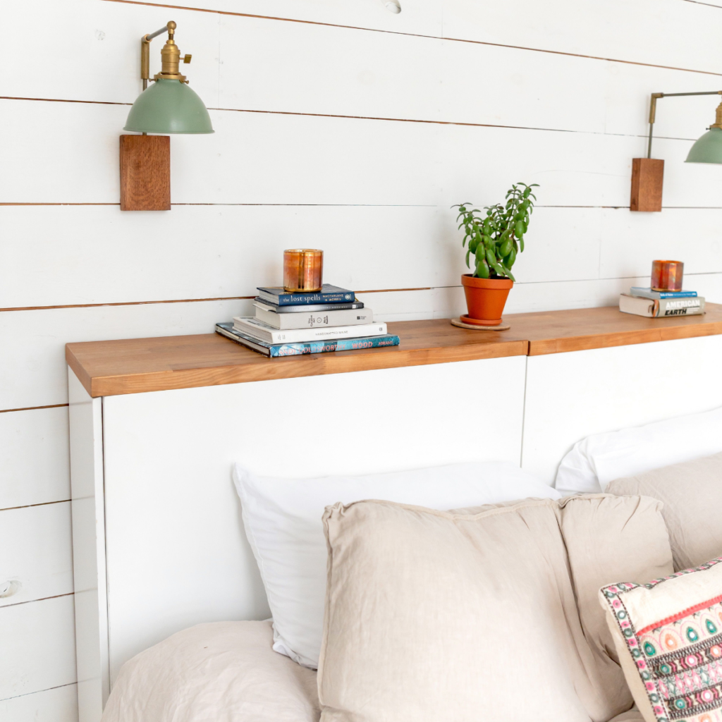 white shiplap peel and stick accent wall with shelf decor in rental bedroom